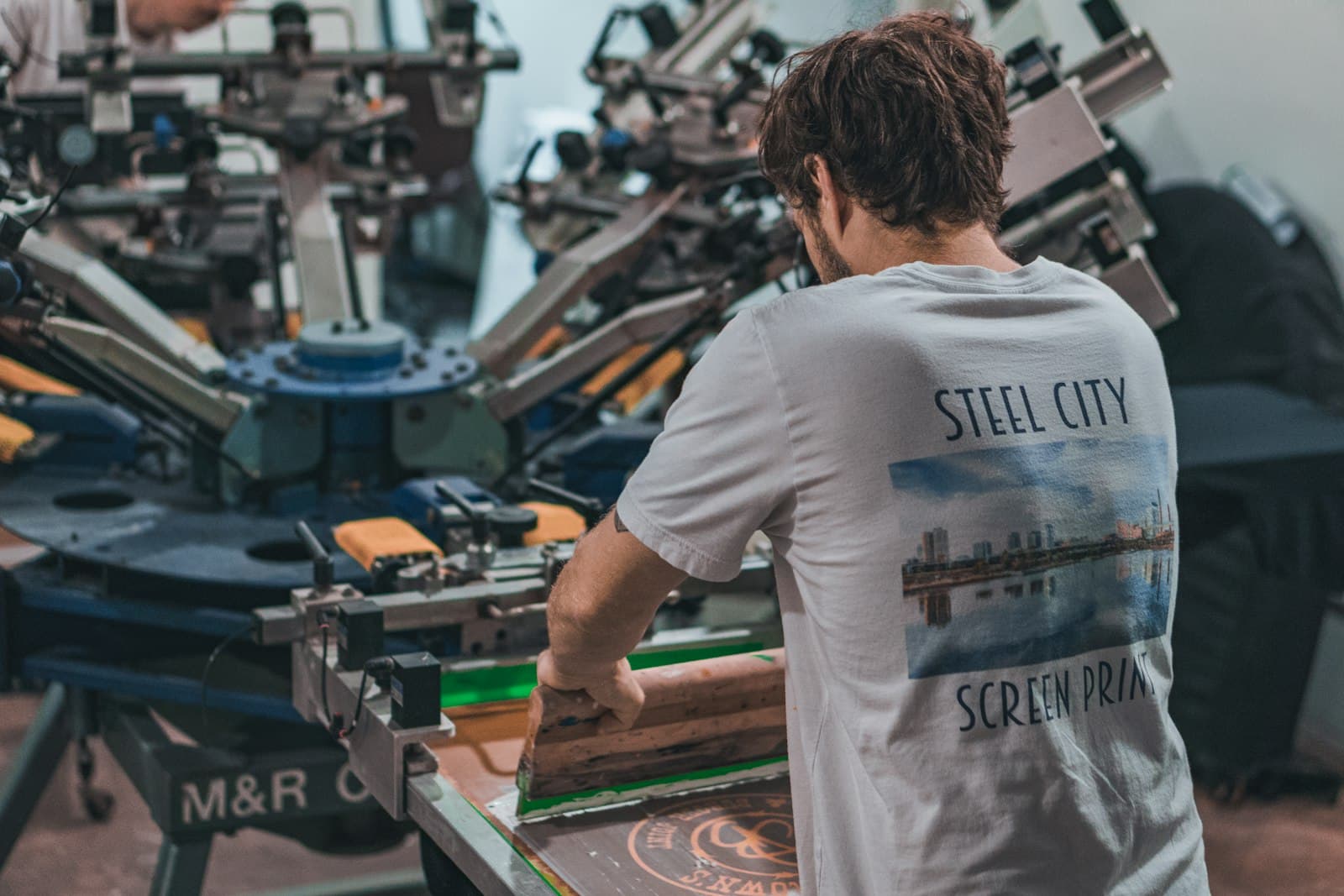 Operator at a printing carousel on the production floor